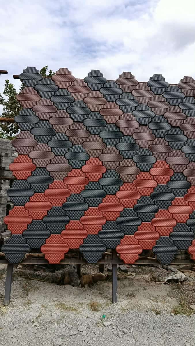 Unipaver cabro sample panel in grey, charcoal and red diagonal bands