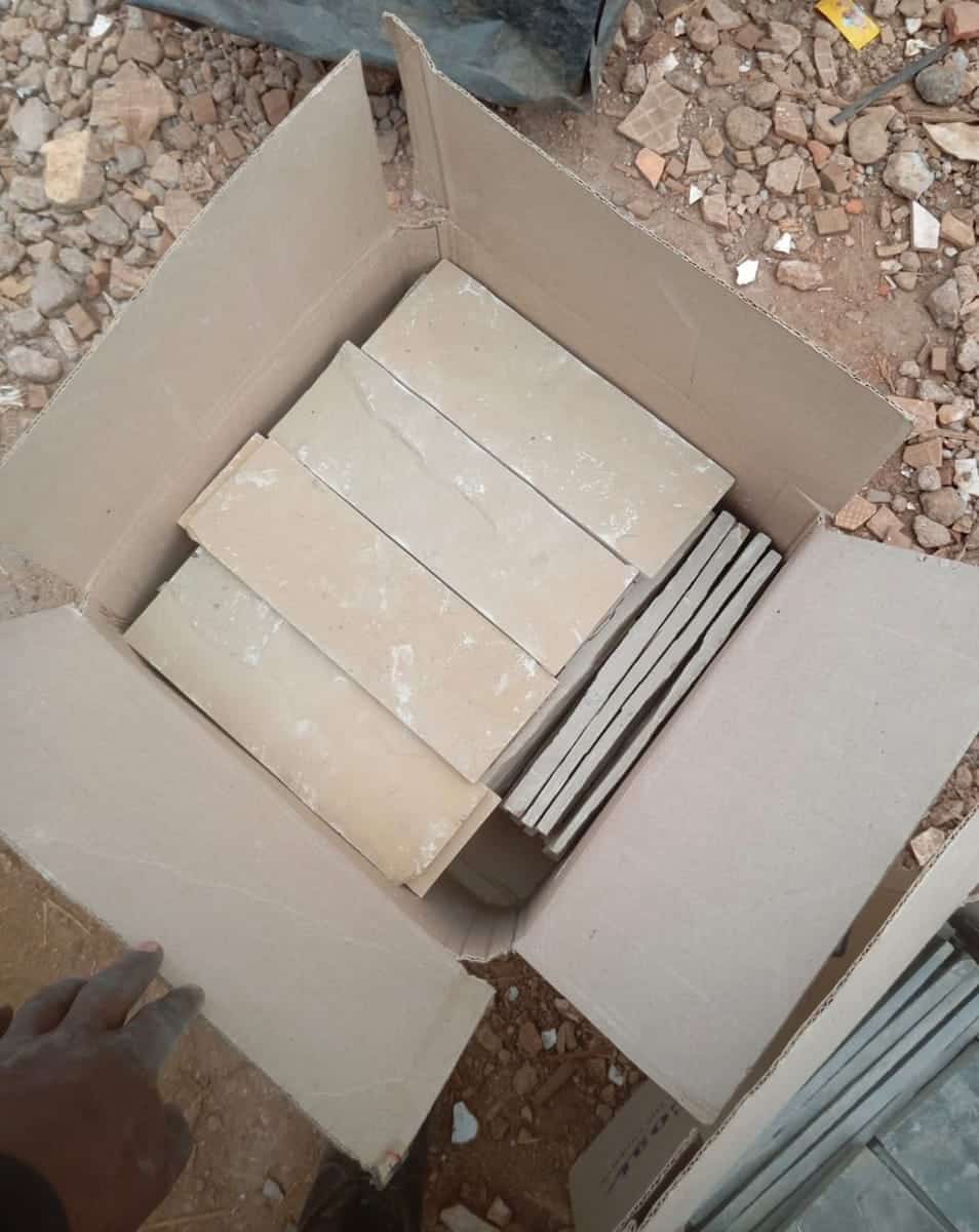 Cut coral stone tiles packed in a carton ready for delivery
