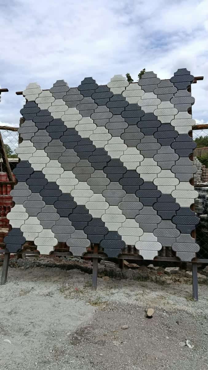 Grey and charcoal trihex cabro blocks laid in diagonal stripes on a display panel
