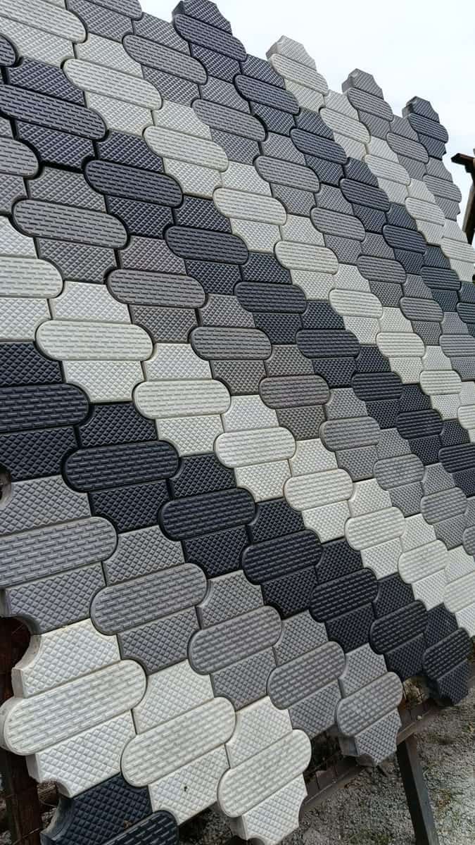 Grey and charcoal unipaver cabro blocks with a textured face in a two-tone layout
